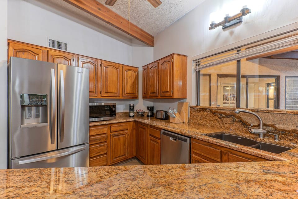 Modern kitchen is well stocked with everything your chef needs to prep and serve meals.