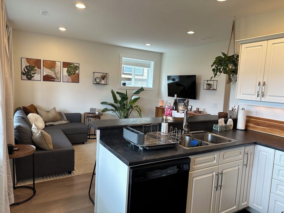Eating bar, dishwasher, sink, with everything you'll need to feel at home.