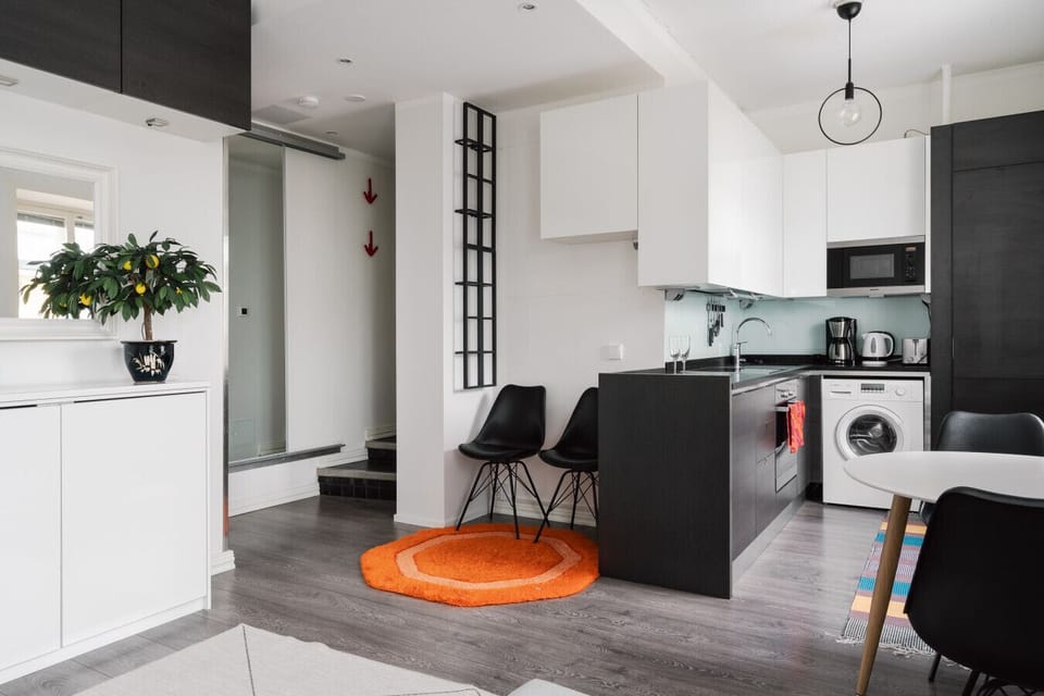 Open kitchen space flows into the living area, ideal for socializing while prepping meals.