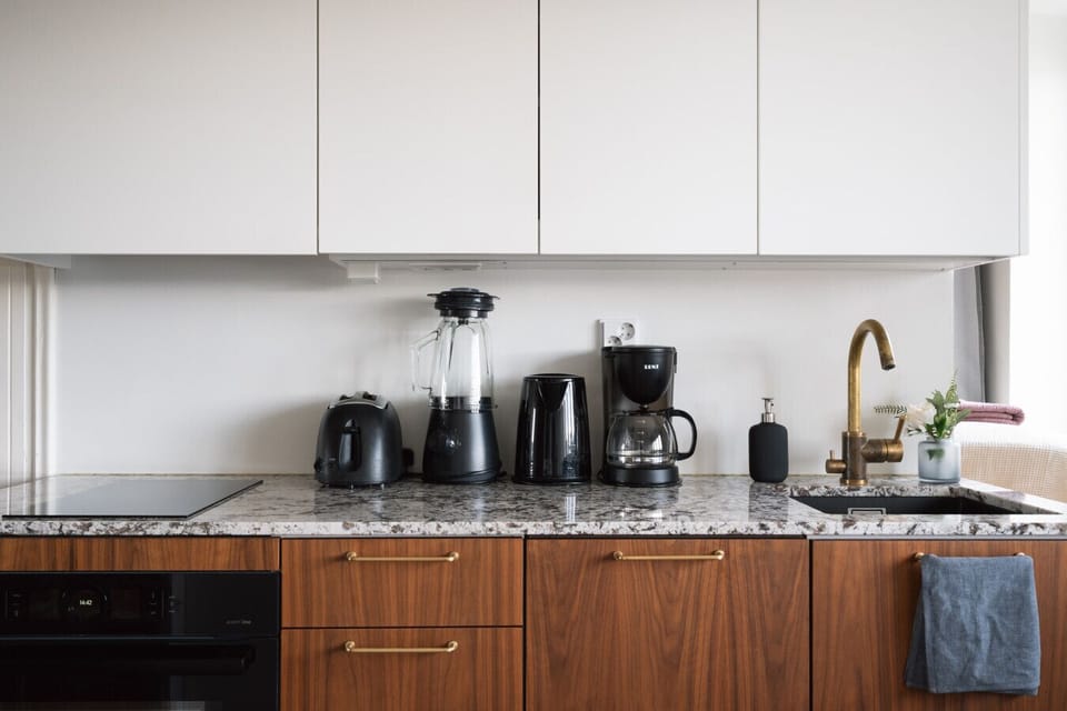 Apartment kitchen is modern and well equipped
