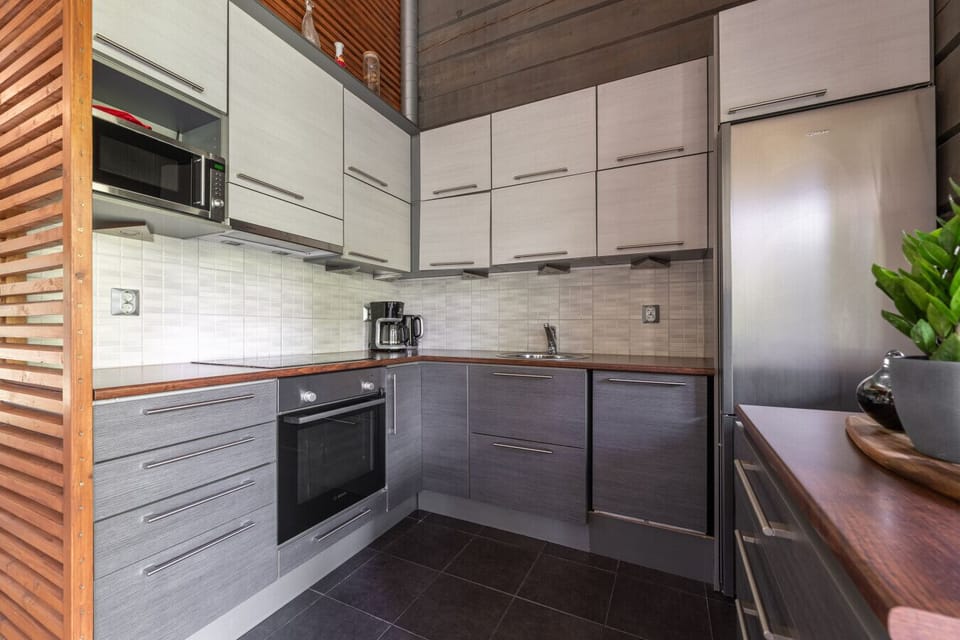 After a day outdoors, curl up by the fireplace, cook a great meal in the modern kitchen