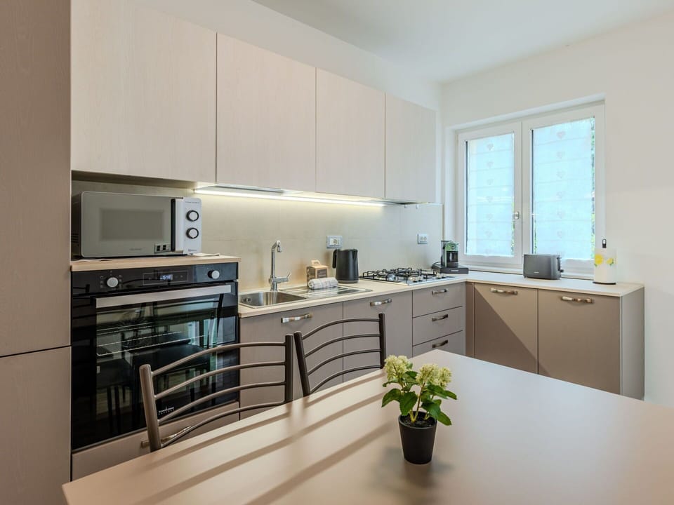 Kitchen, Kitchen Appliance, Countertop, Interior Design, Furniture, Major Appliance, Cabinetry, Wood, Flooring, Ceiling