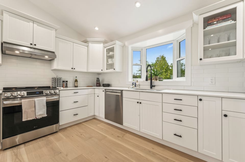 This bright, modern kitchen includes everything you need—stainless steel appliances, ample counter space, and a great view while you cook.