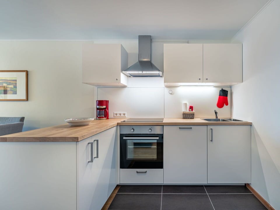 Kitchen, Countertop, Interior Design, Kitchen Appliance, Flooring, Major Appliance, Wall, Cabinetry, Wood, Floor