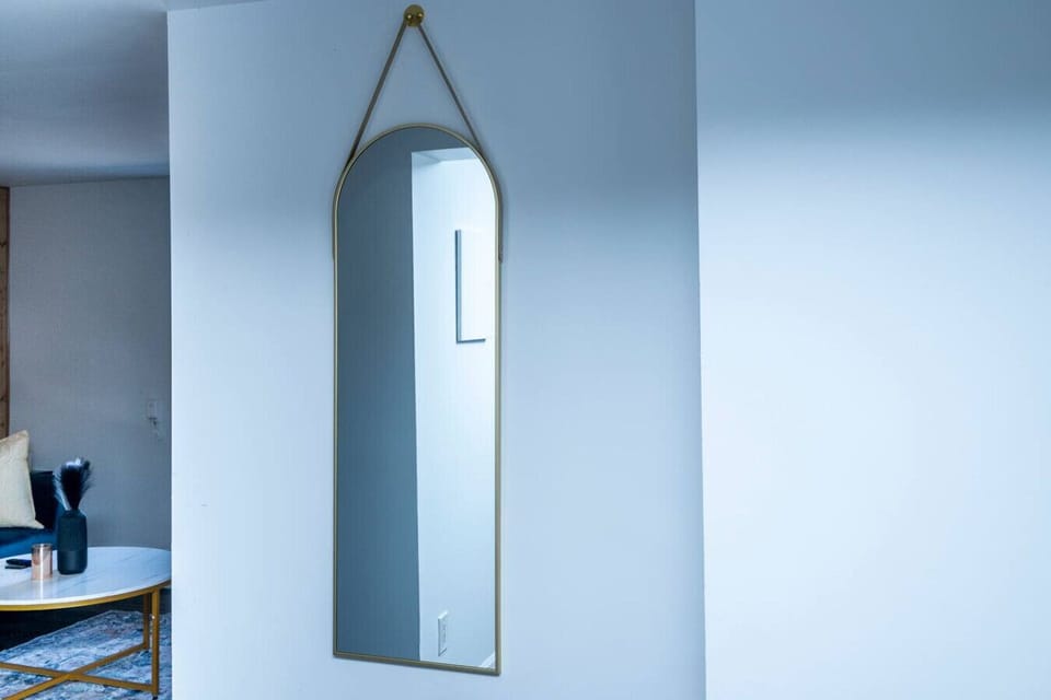 Get ready for your day or a night out with this stylish full-length mirror. Perfect for a quick outfit check or adding light to the space. Thoughtful touches elevate your stay.