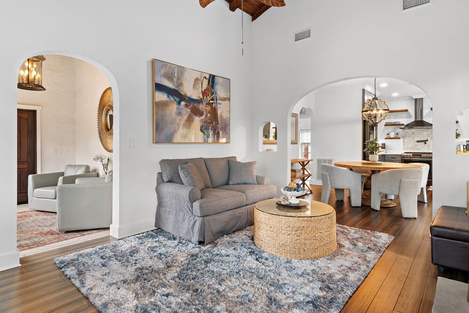 A comfortable and stylish living room with a cozy rug invites relaxation and connection in this lovely home.