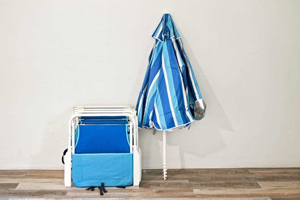 Beach gear available for guest use — including lightweight folding chairs and a compact beach umbrella for easy days at the coast.
