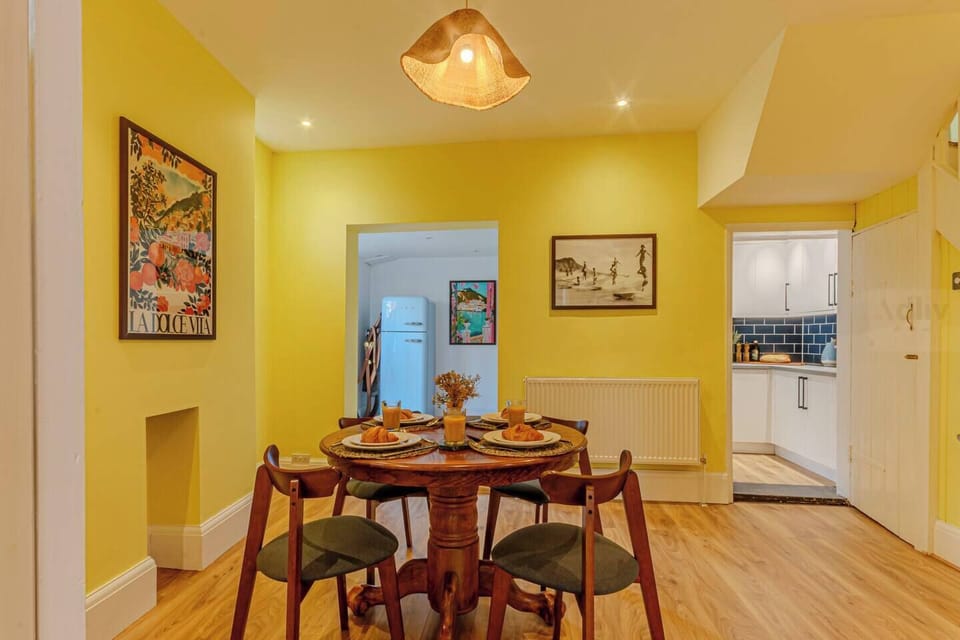 Open-plan dining flows to the lounge and kitchen, perfect for meals, games, or casual chats