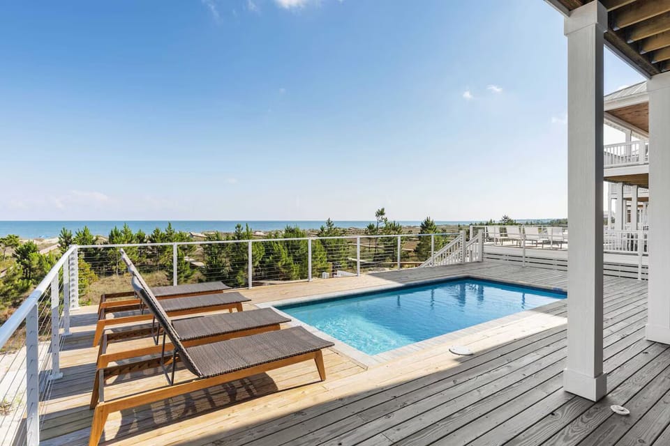 The elevated pool provides stunning views of the Gulf
