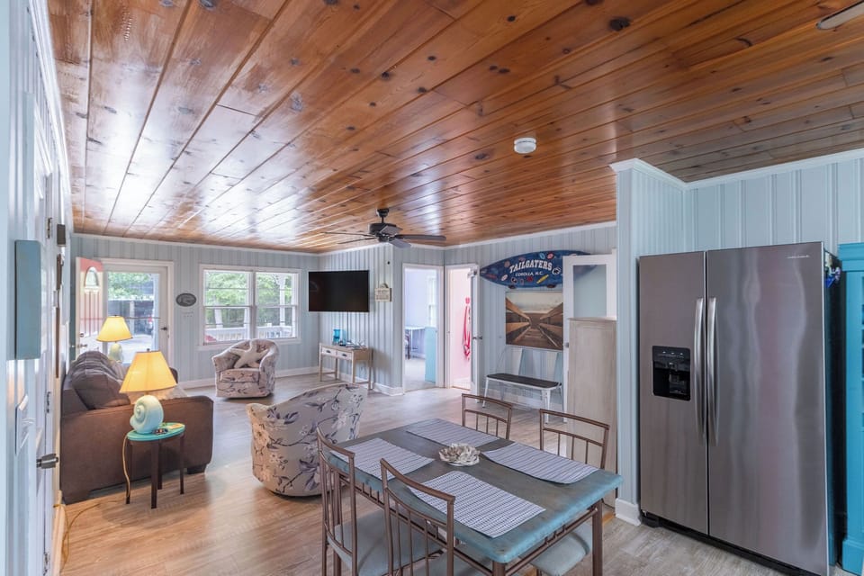 Dining Area - The natural light, open kitchen and wood ceilings in the dining area are made for great conversations.