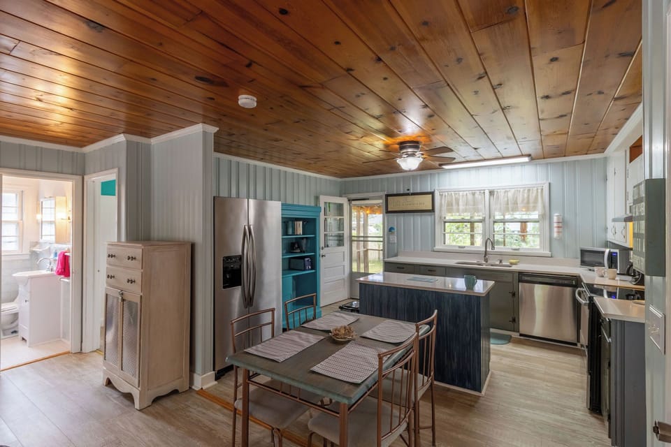 Dining Area - The natural light, open kitchen and wood ceilings in the dining area are made for great conversations.