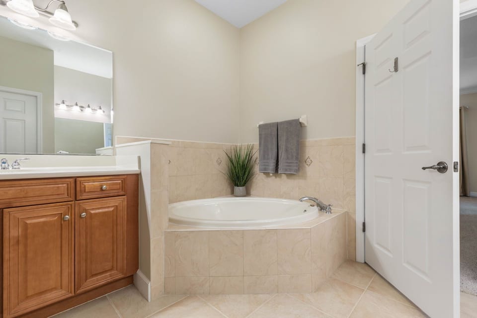Master Ensuite with Dual Vanities, Soaking Tub and Separate Shower.