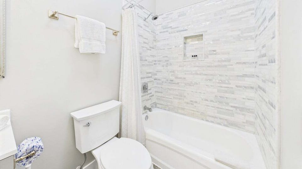 Full bathroom with shower and tub combo