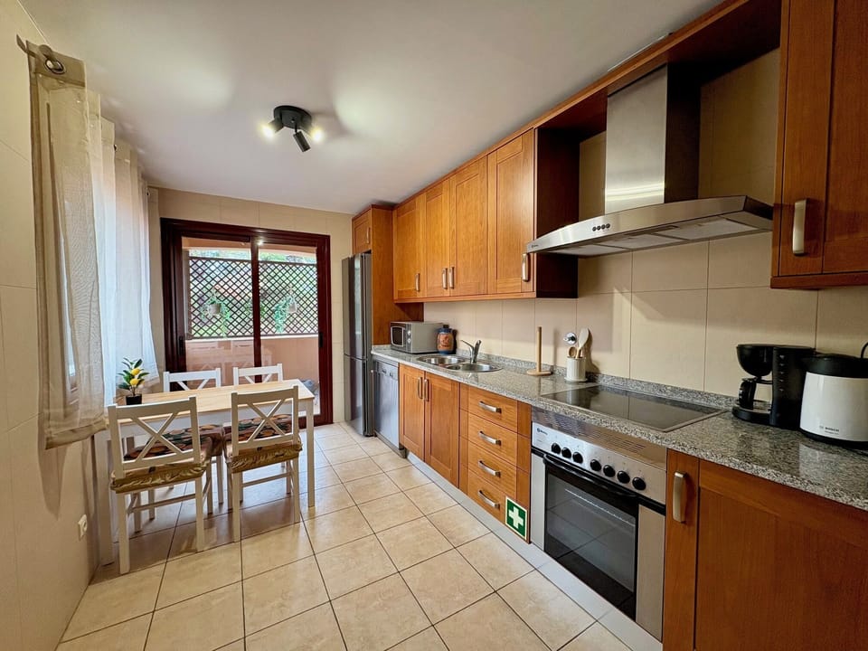 kitchen with re-arranged table and a new Bosch fridge