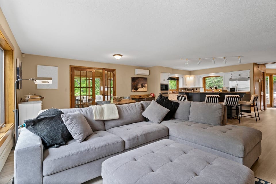 Open living and kitchen area leads to sunroom