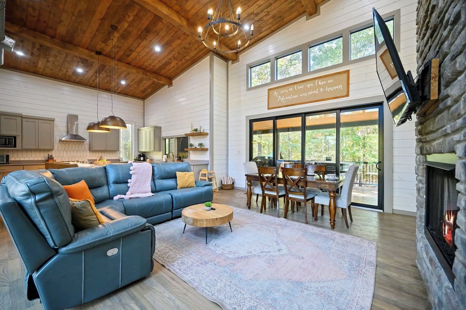 The perfect spot for slow mornings and cozy evenings. Open the sliding doors to let the forest air in, or sink into the leather recliner for a movie night by the fire