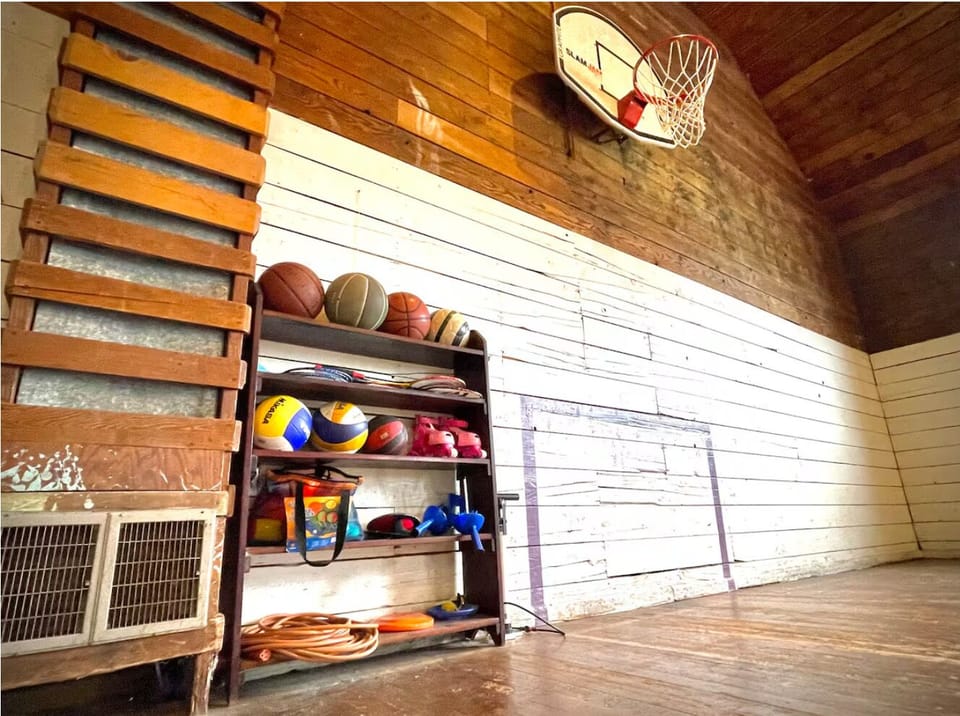 The gymnasium and sports court comes fully stocked with equipment. 
