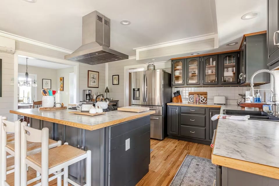 Cook's kitchen featuring 4-barstool island seating.