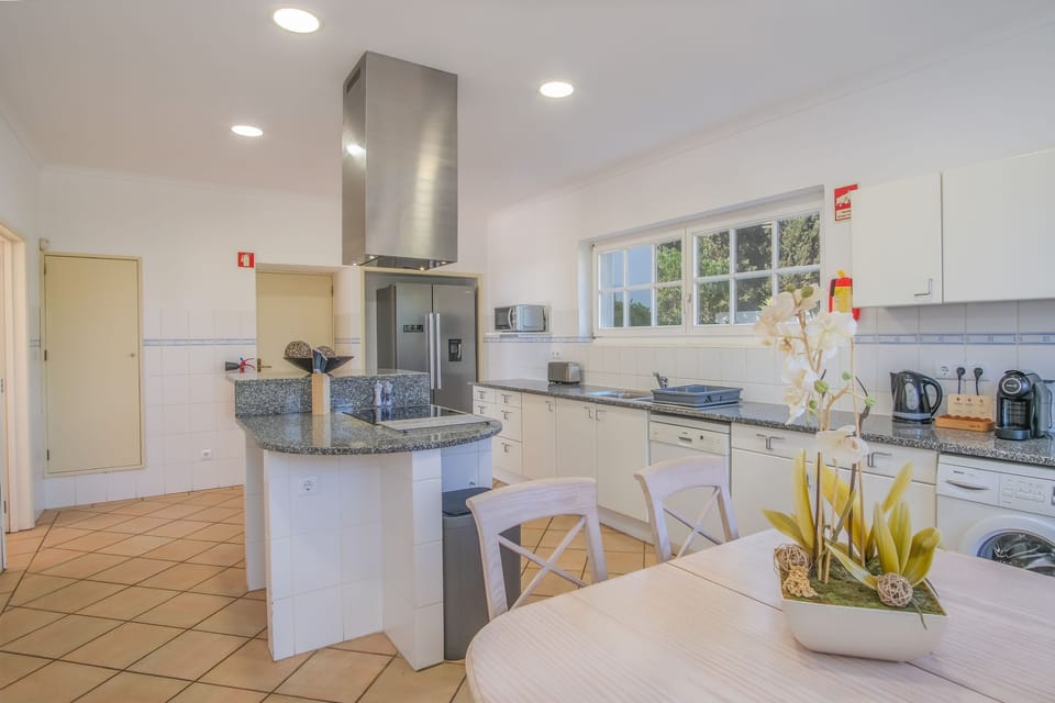 Spacious kitchen with fitted appliances