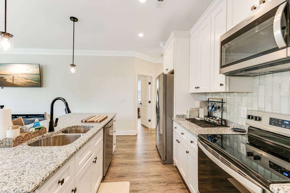Kitchen is stocked with all major appliances for your use (dishwasher, microwave, oven/stove top and large fridge, double deep basin sink)