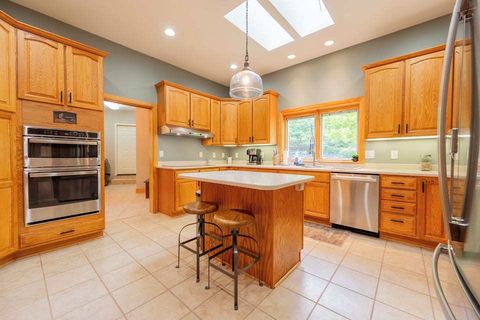 Freshly updated kitchen with island seating. 