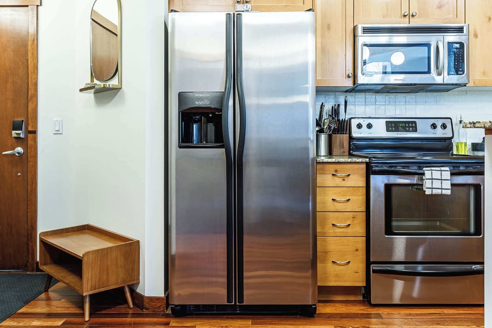Where your stay begins. An inviting entrance and a beautifully appointed kitchen.