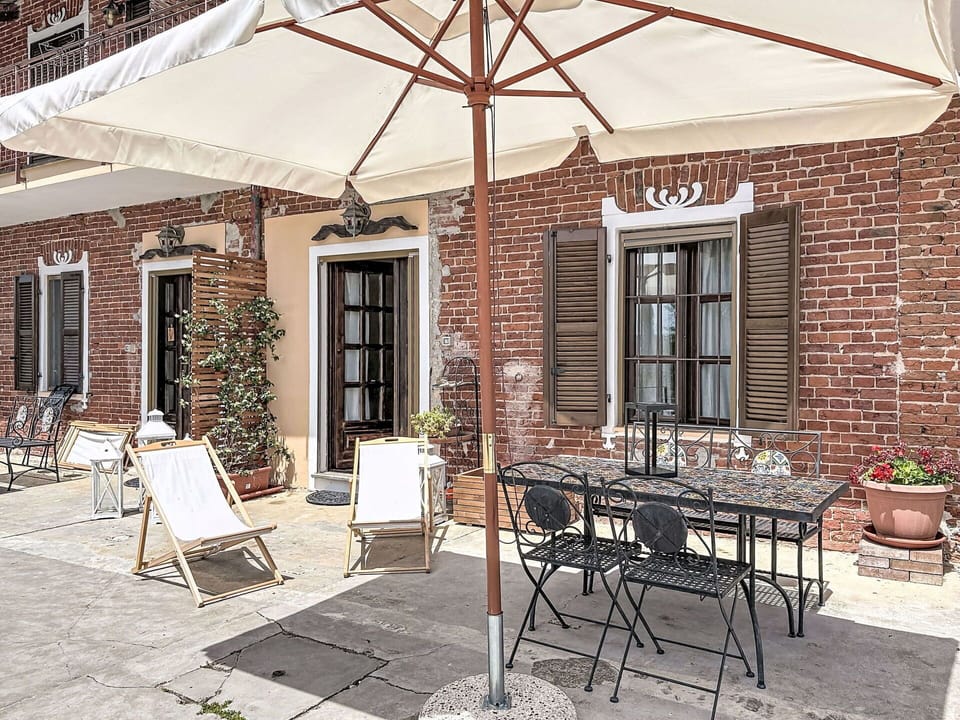 Door, Brick, Outdoor Table, Outdoor Furniture, Chair, Flowerpot, Iron, Umbrella, Houseplant, Shade