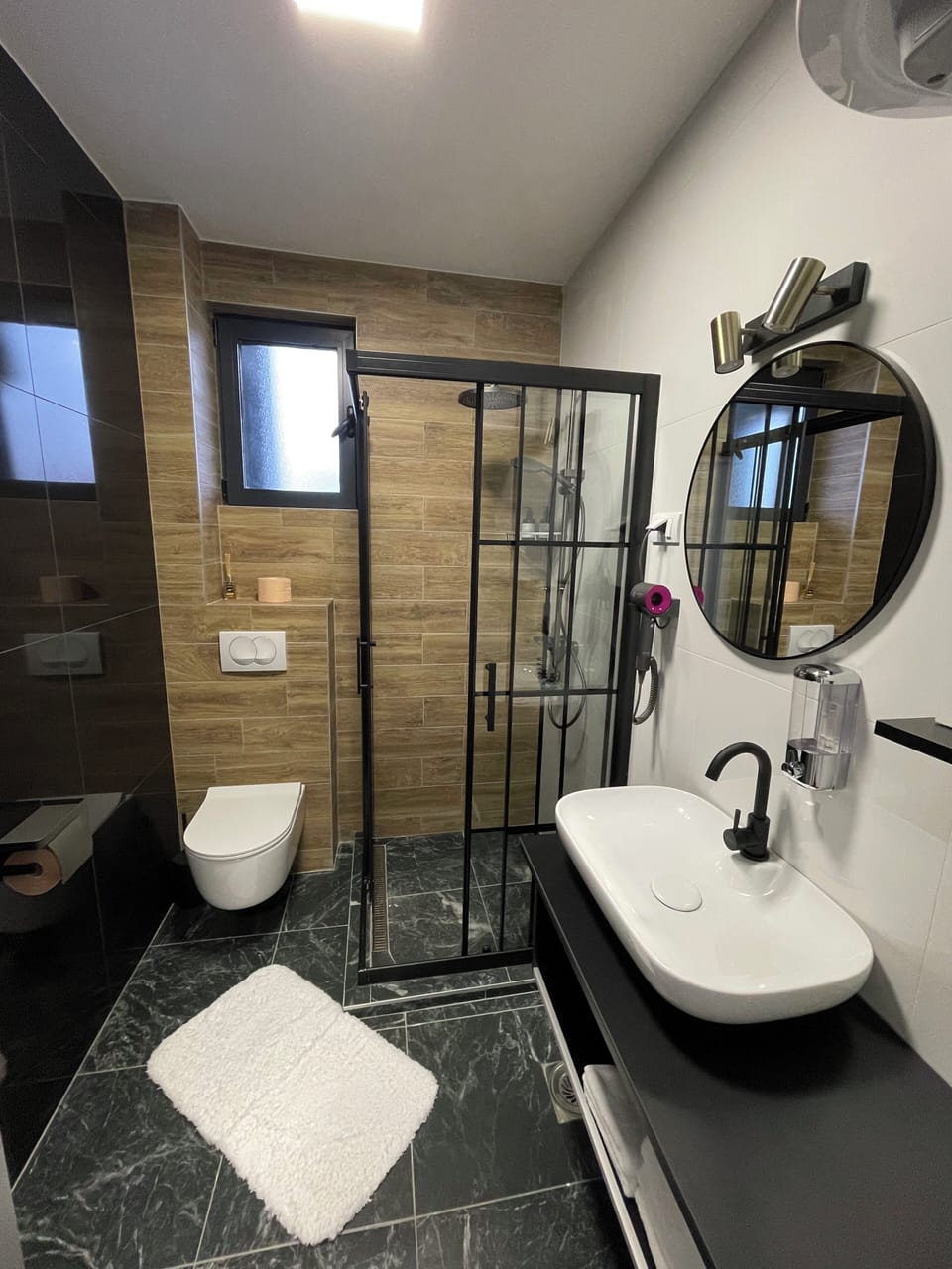 Shower, hair dryer, slippers, towels