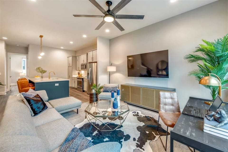 Units A, C & E | Open Concept Living Room | XL Flat Screen TV | Ceiling Fan | Same Layout Across All Three Units | Second Floor
