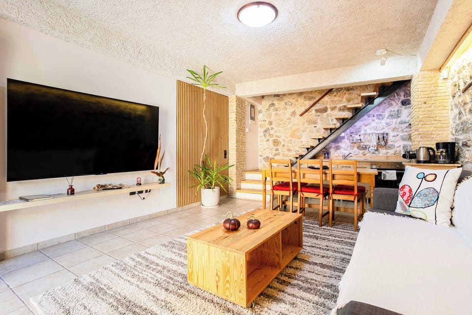 Bright Open-Plan Living Area with Smart TV and Stone Details