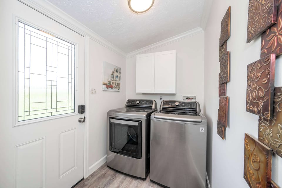 Private laundry is available for your stay, tucked away off the kitchen