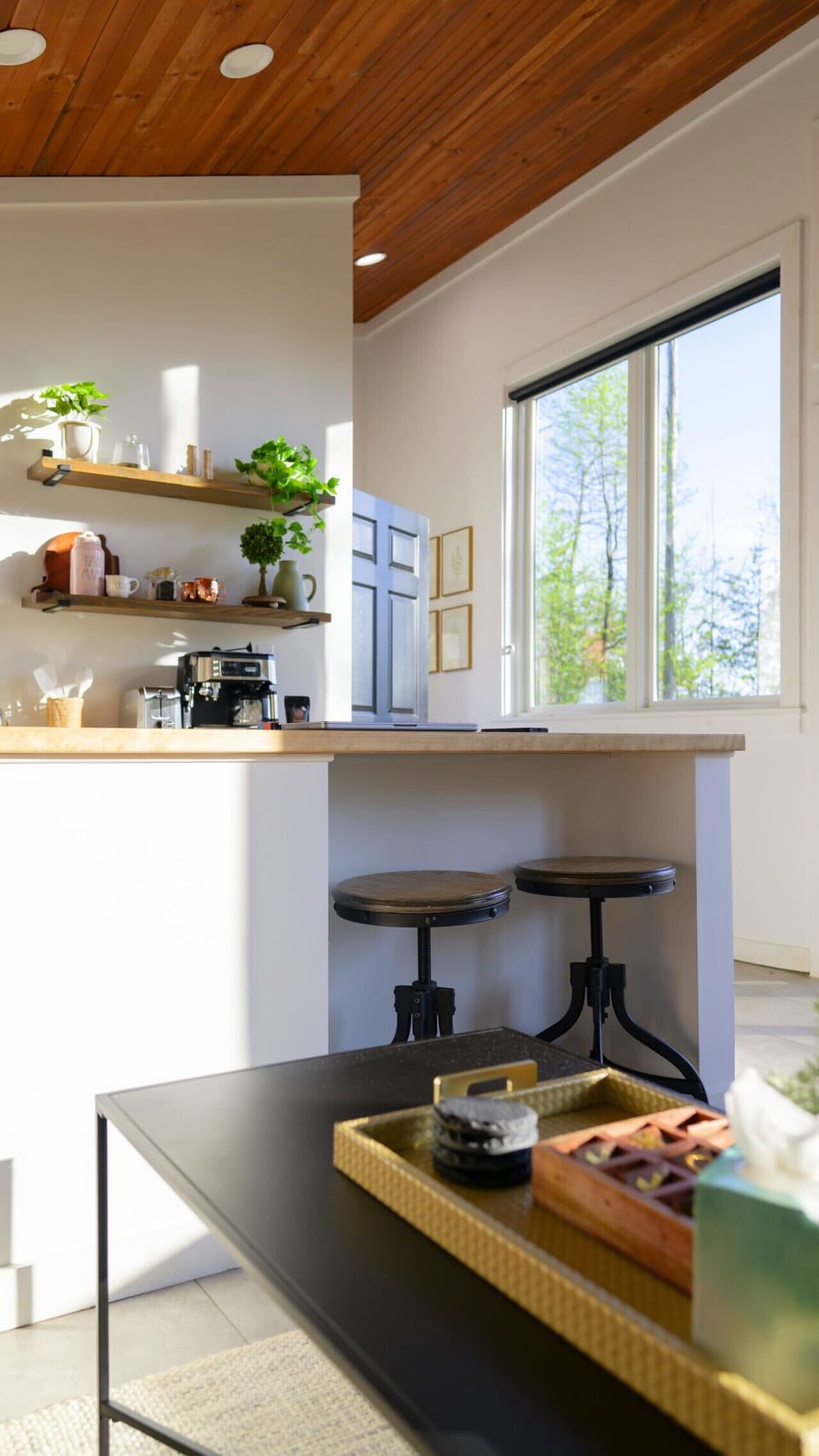 The butcher block countertop comes with two bar stools to enjoy breakfast or any meal during your stay
