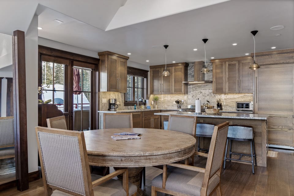 Comfortable dining seating for 4 opens up into the kitchen