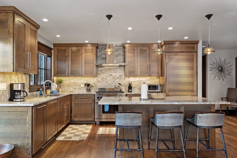 Large, stocked kitchen with plenty of seating and open concept layout