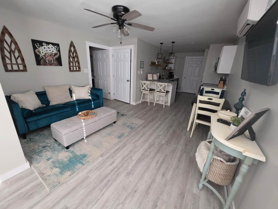 Open concept livingroom off the full kitchen