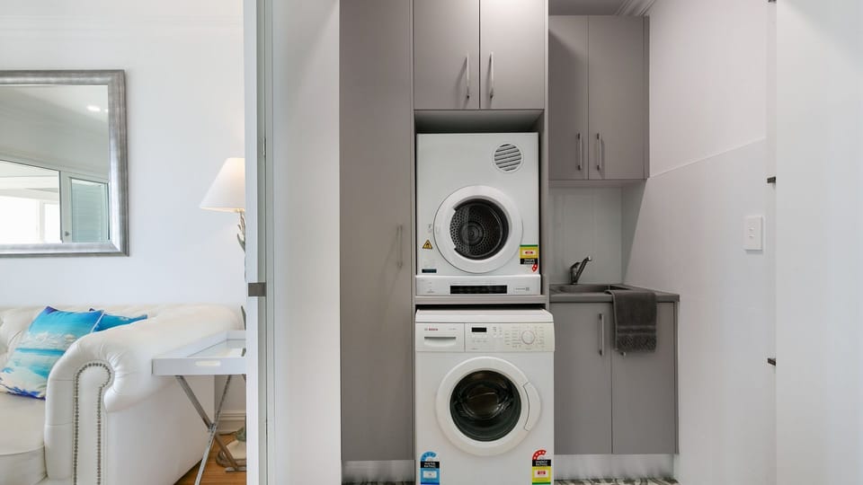 Enclosed laundry with washing machine and dryer