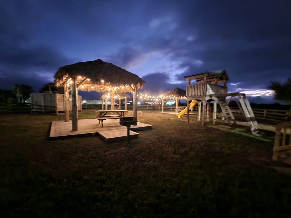 Park palapas, picnic tables & playground. 