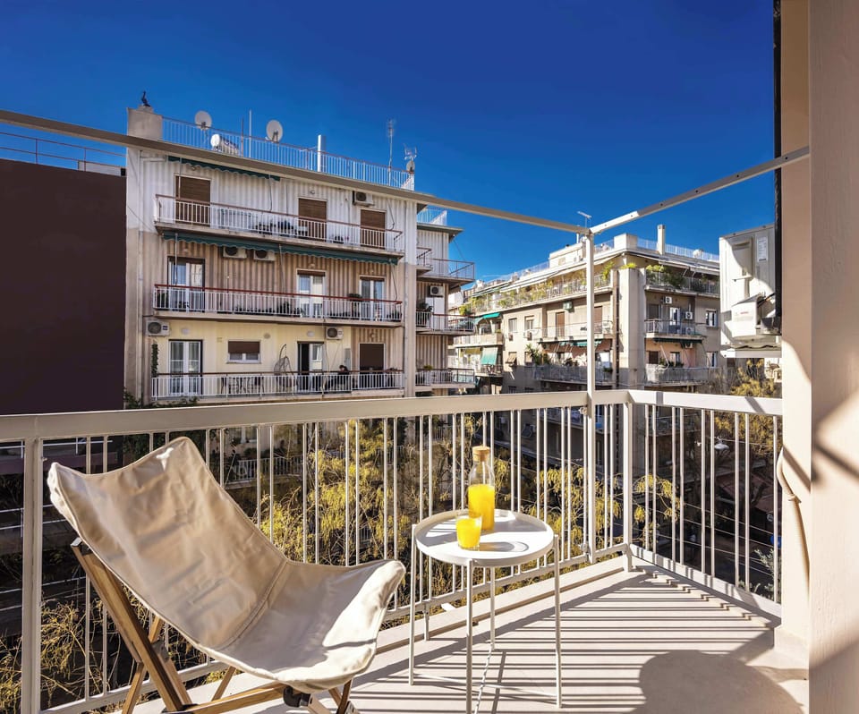 Private balcony with open neighborhood views, perfect for sunny morning coffee moments outdoors.