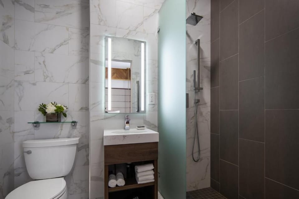 Shower, hair dryer, slippers, towels