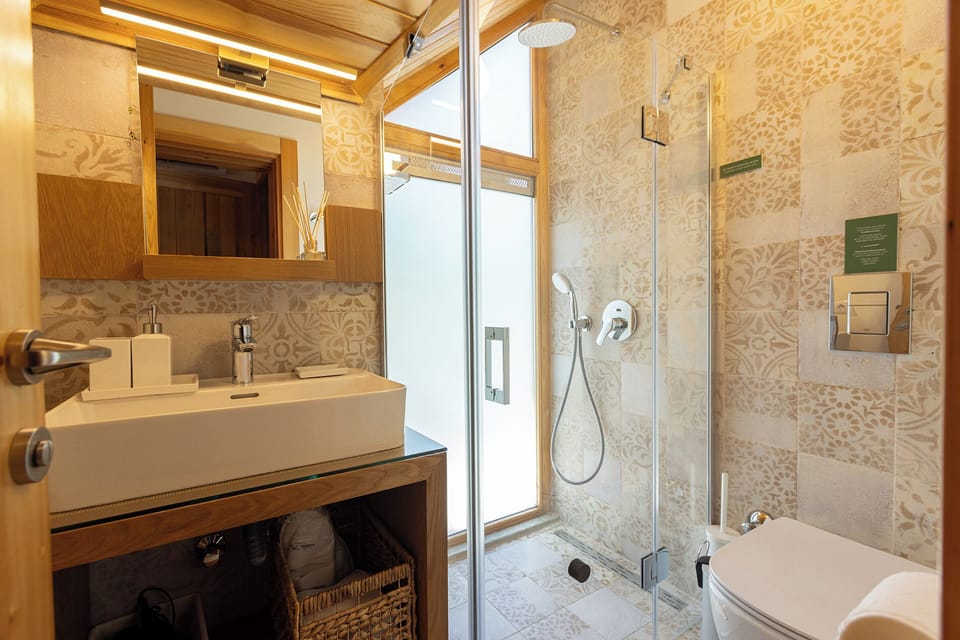 Double Room - Partial Sea View | Bathroom | Shower, hair dryer, slippers, towels