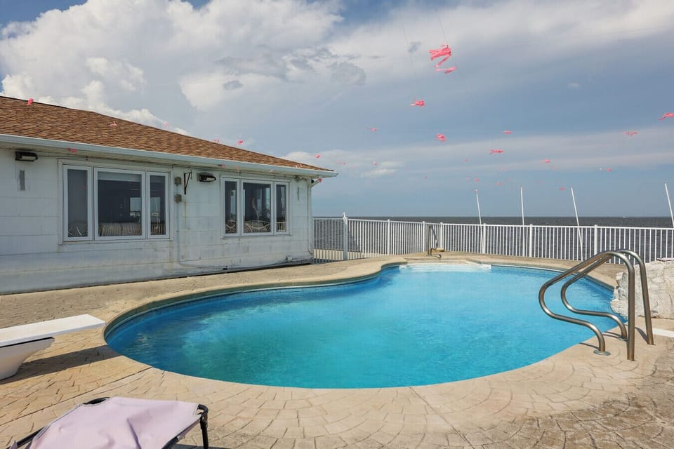 Relax in the fresh water pool while admiring the ocean view.