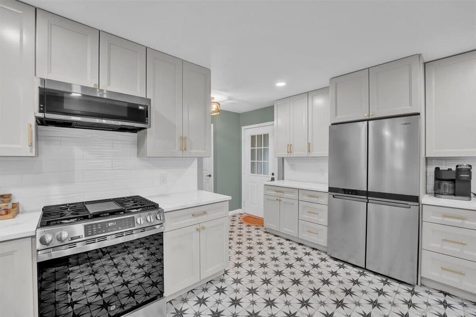Bright Chef’s Kitchen with Gas Range and Modern Cabinets