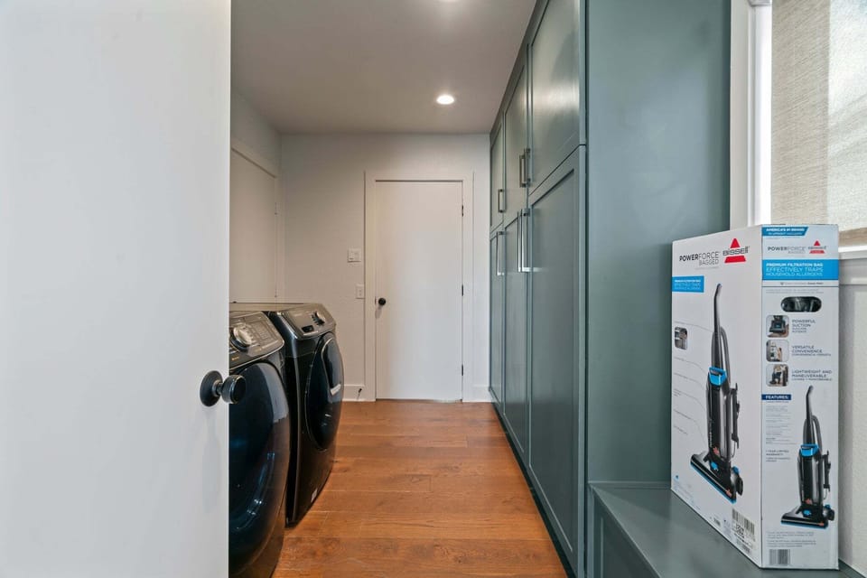 Washer and Dryer located near the kitchen.