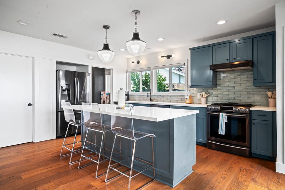 Beautifully updated kitchen with additional seating at the island bar.