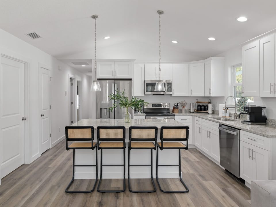 A seamless blend of function and comfort in this cozy kitchen and dining area.