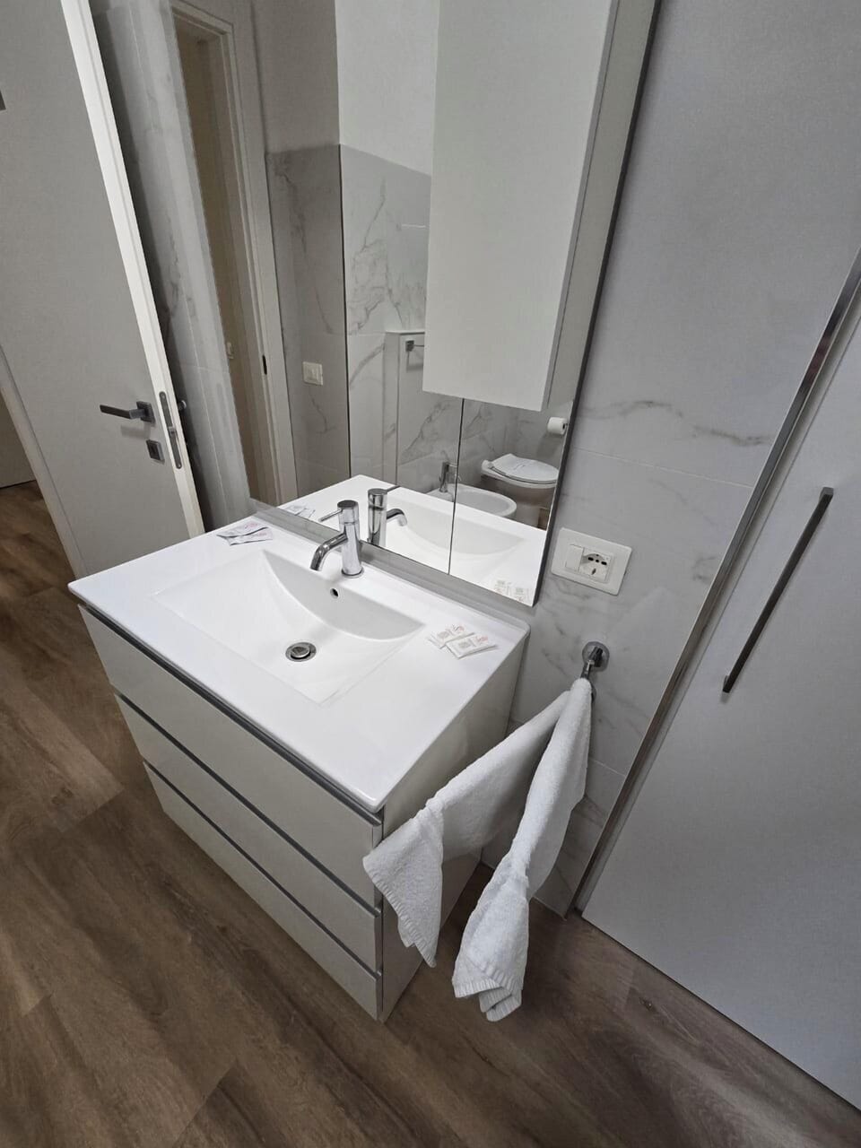 Hair dryer, bidet, towels, soap
