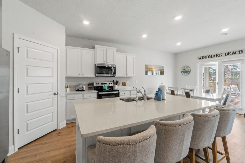 Your spacious kitchen island becomes the heart of your stay, perfect for morning coffee or evening gatherings with loved ones.