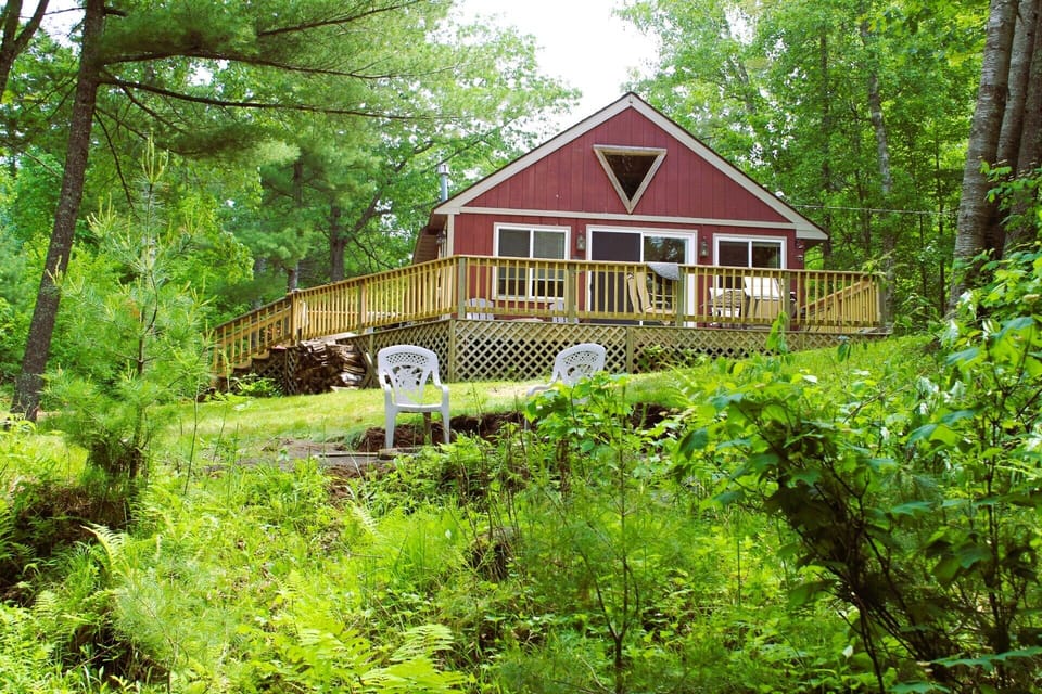 Lakeside view of cabin and deck.