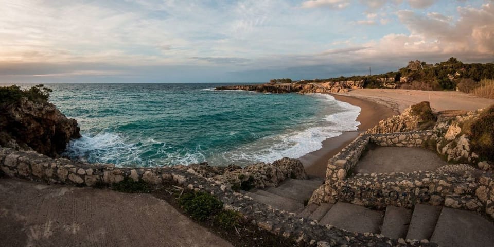 Stomio Beach – Rocky Coastline and Clear Blue Waters (4 km)

