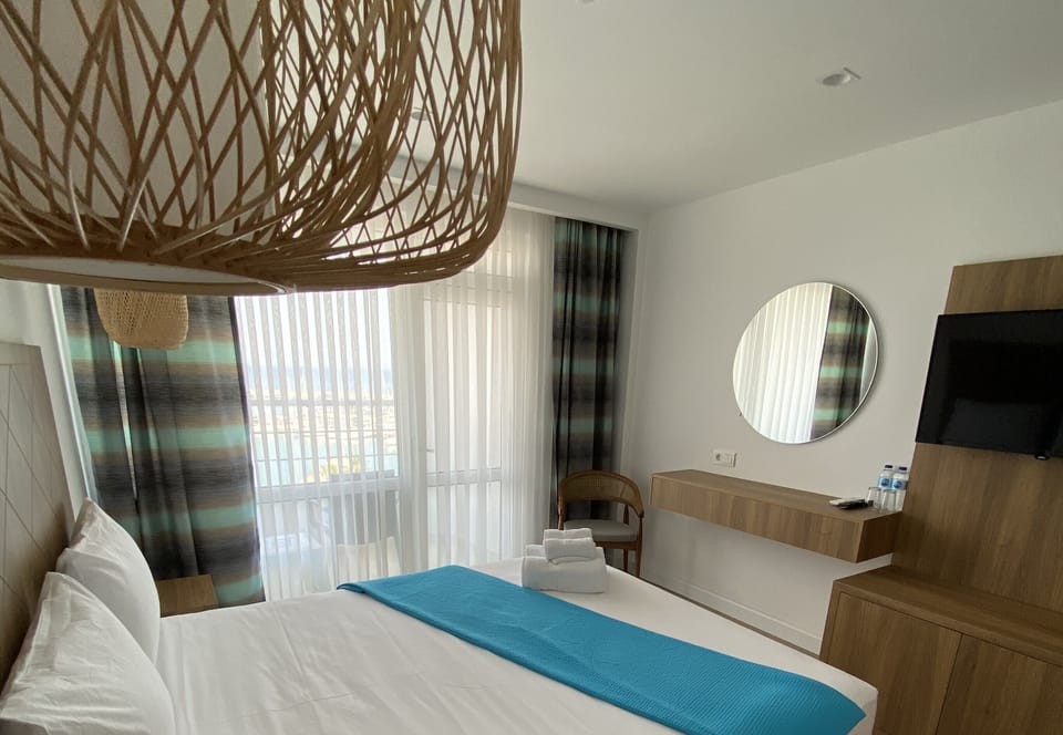 Deluxe Room, 1 Double or 2 Twin Beds, Balcony, Sea View | Minibar, in-room safe, soundproofing, free WiFi